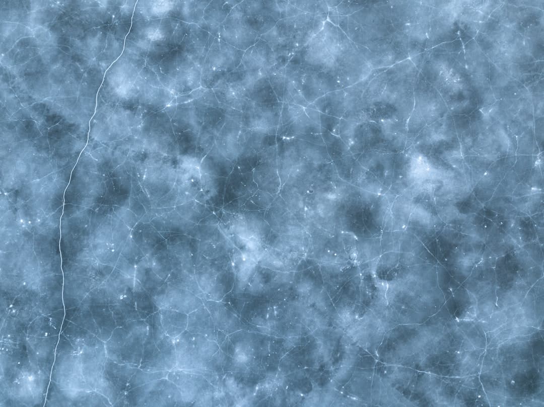 a blue and white textured background with small stars
