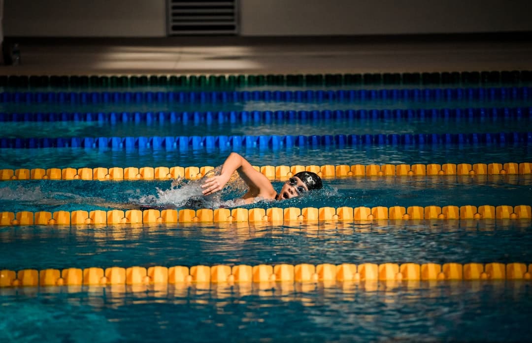 person diving in pool