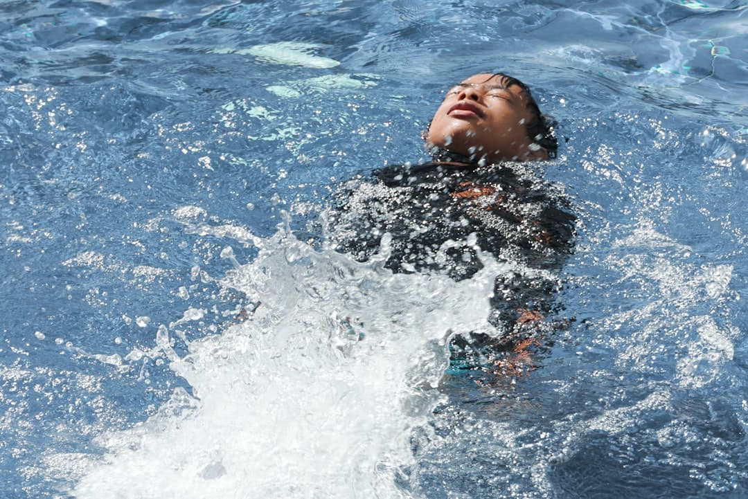 person diving on sea