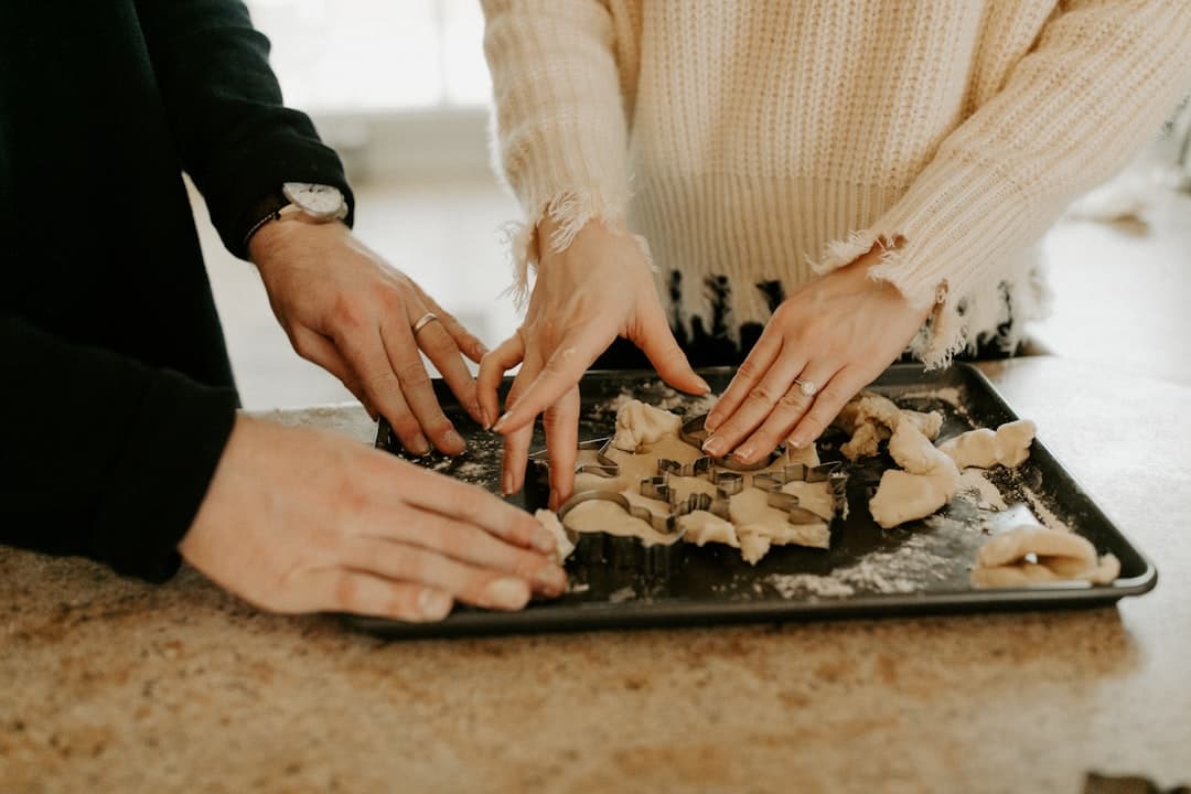 shallow focus photo of person touching black tray