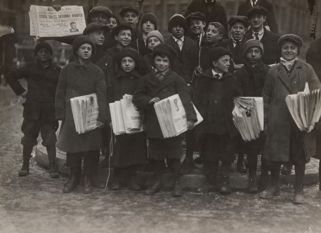 group of men standing on the street