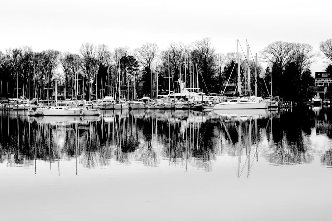 grayscale photo of boat on water