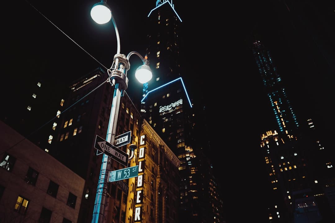 street light near high rise buildings during night time