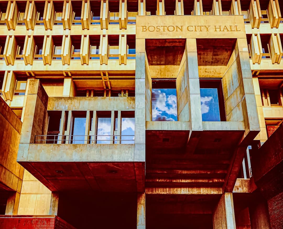 brown concrete building with glass windows