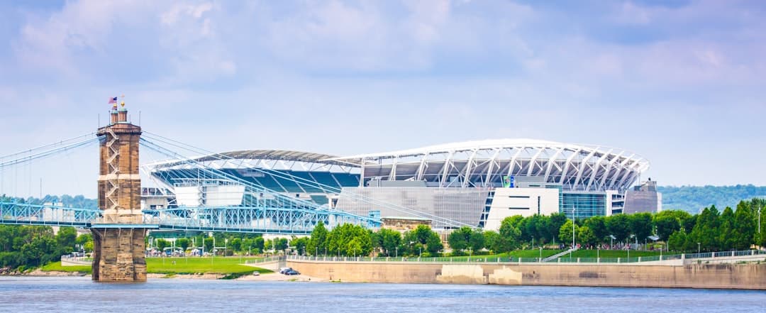 white and blue stadium under blue sky during daytime