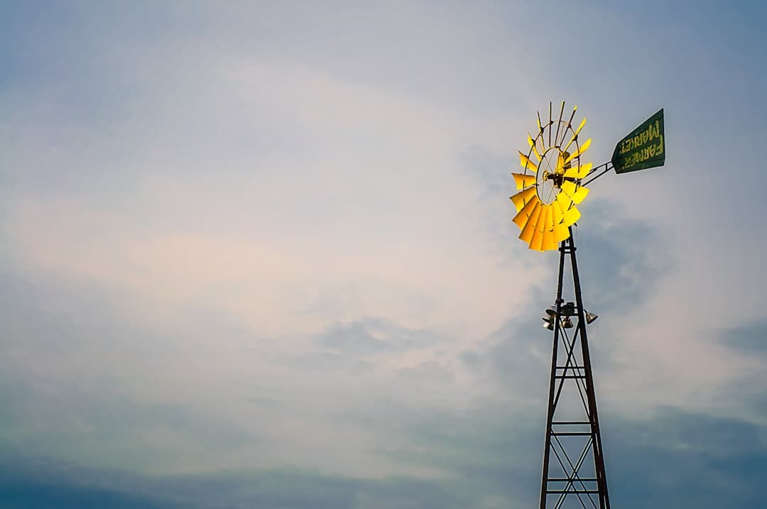 a windmill with a flag on top of it