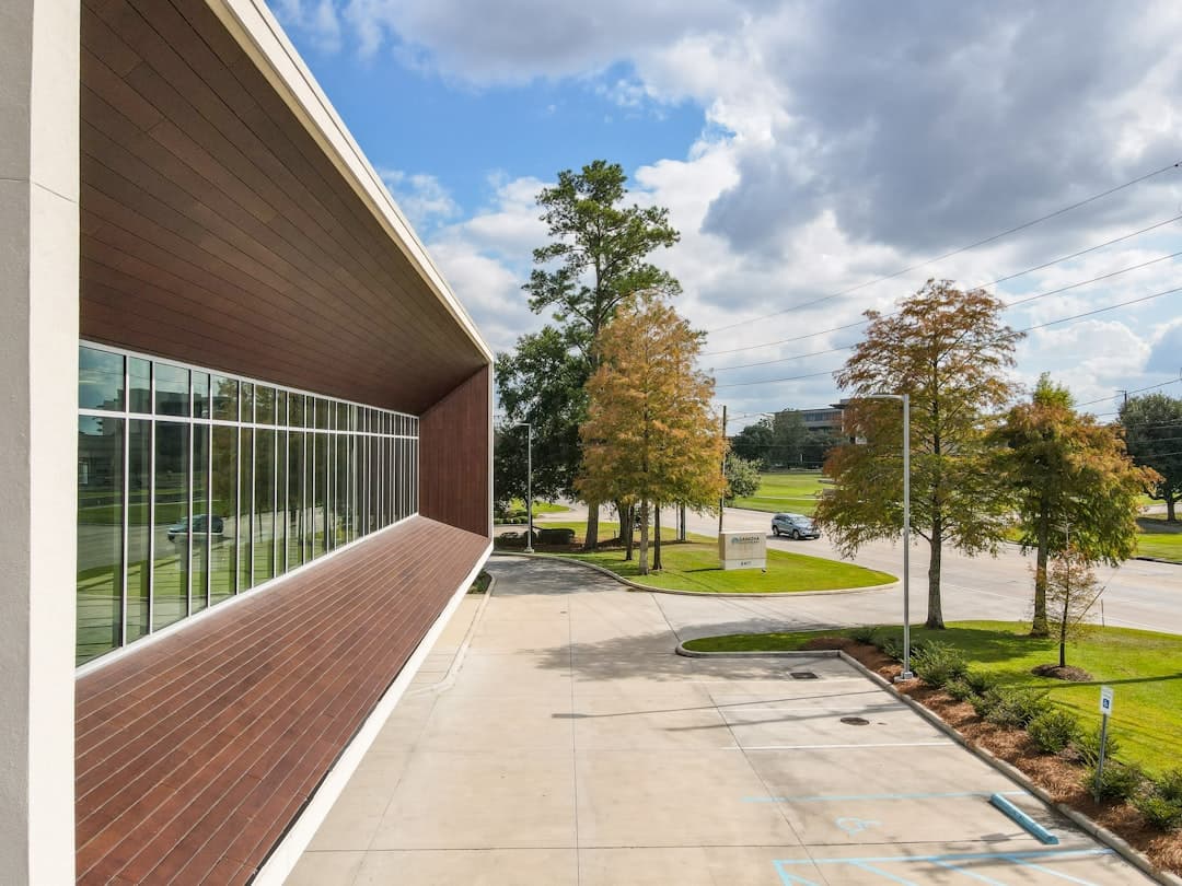 green trees near brown concrete building during daytime