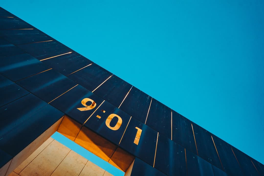 black and white concrete building under blue sky during daytime