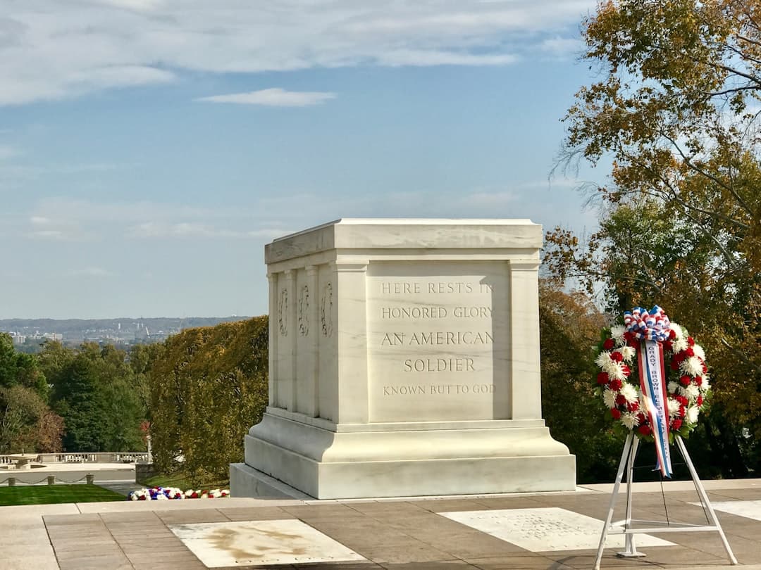 gray concrete tomb under blue sky during daytime