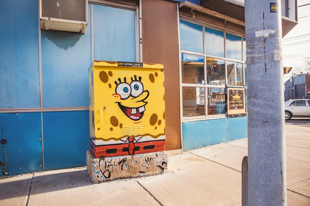 a spongebob box sitting on the side of a building