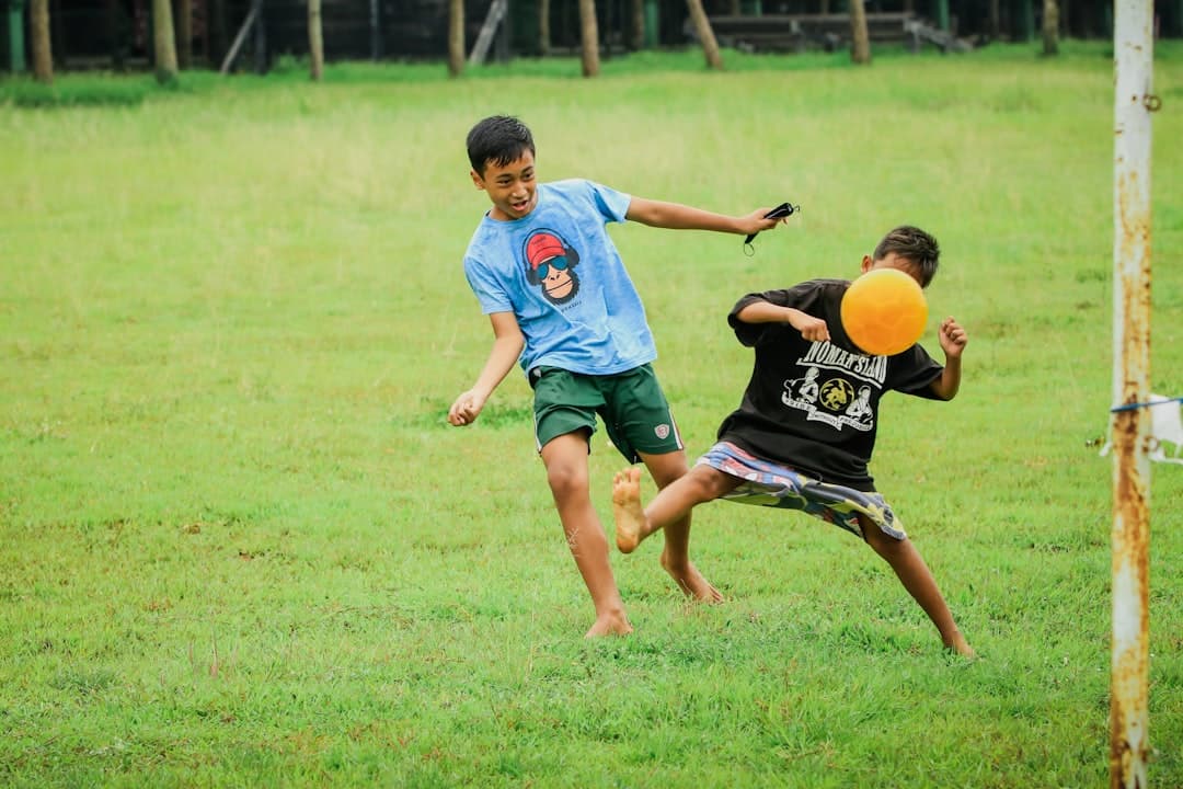 a couple of young men playing a game of frisbee