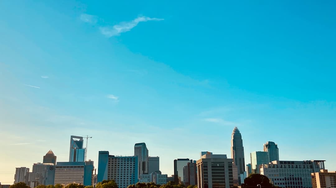 a city skyline with blue sky