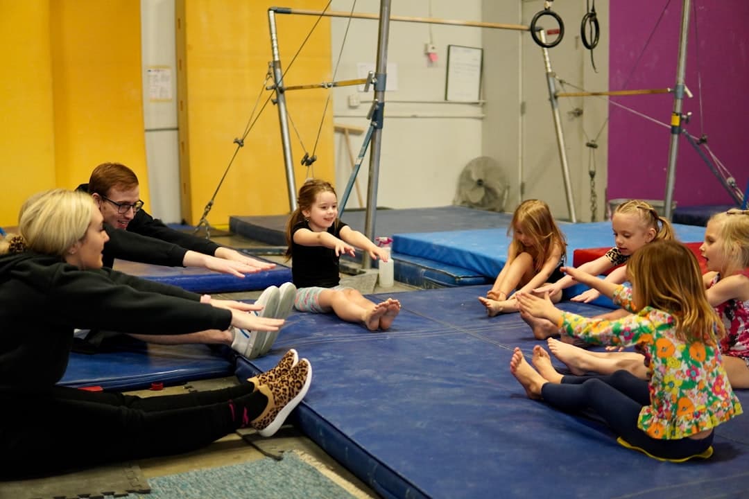 a group of people sitting on mats