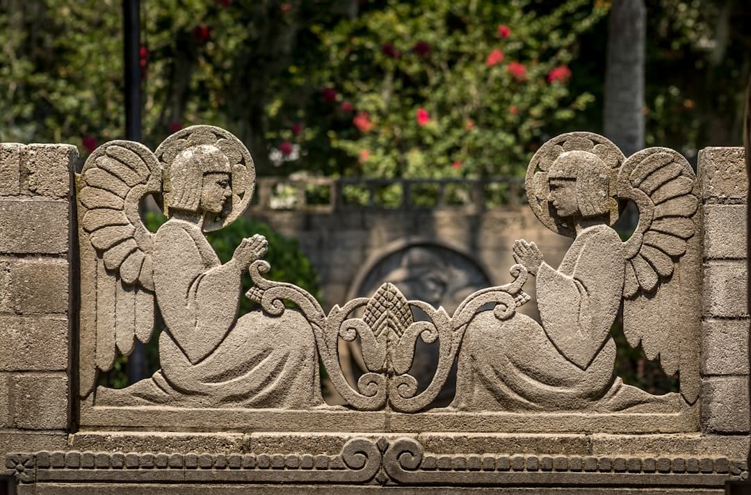 a statue of a person sitting on a bench