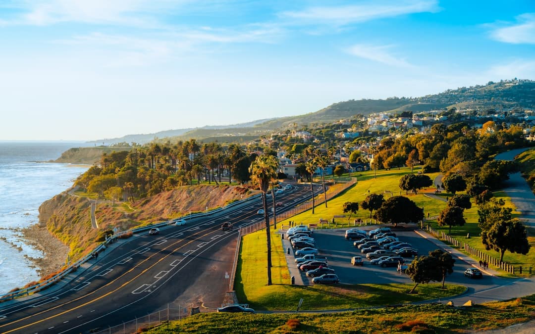 a parking lot next to a beach