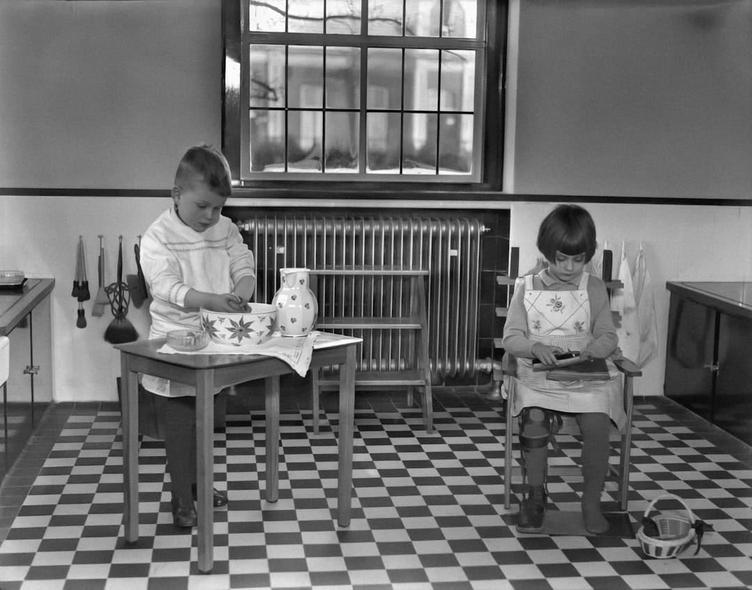 a couple of kids sitting at a table