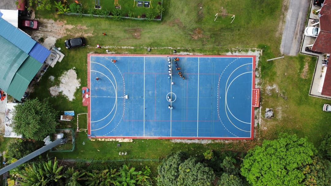 an overhead view of a blue basketball court