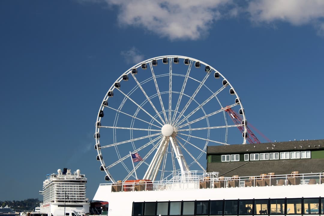 a large ferris wheel sitting on top of a white building