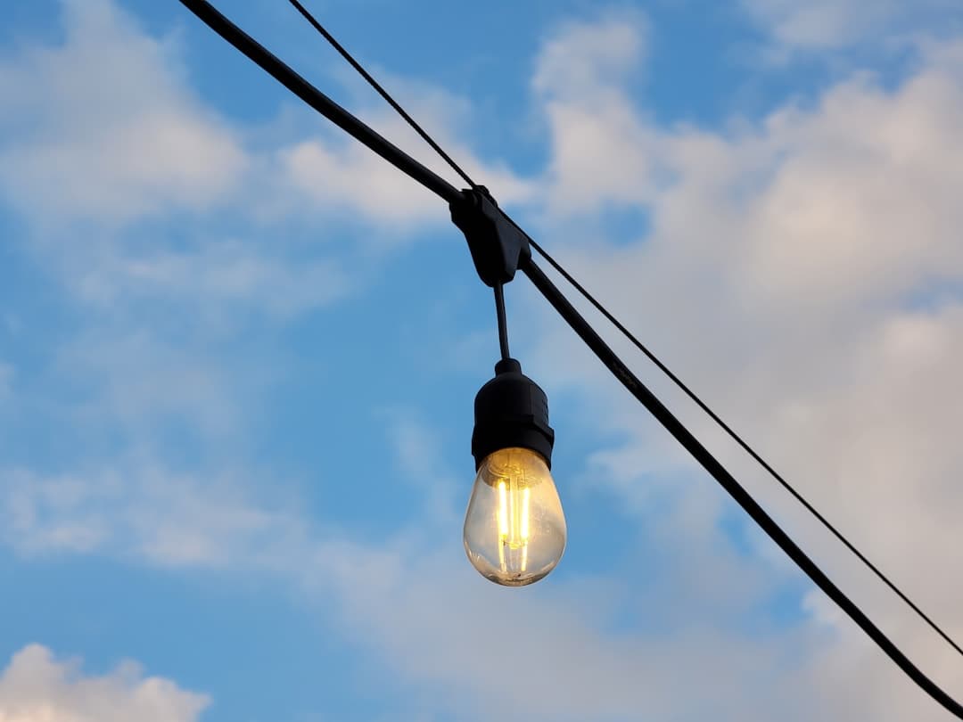 a light bulb hanging from a power line