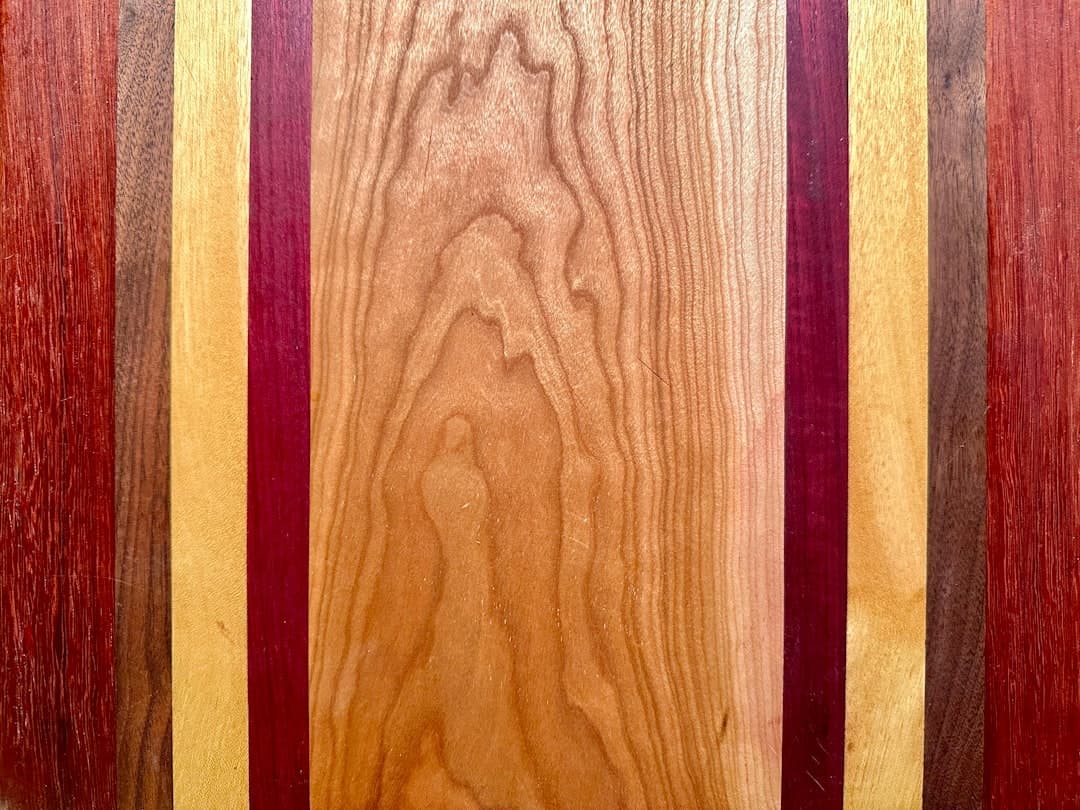 a close up of a wooden surface with different colors