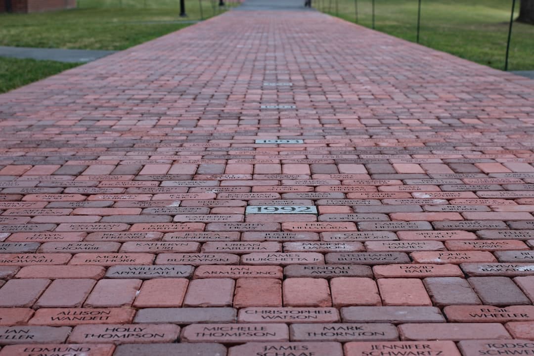 a brick walkway with names written on it
