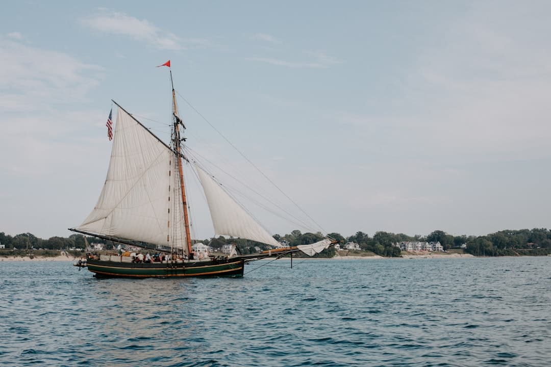 a sailboat sailing across a large body of water