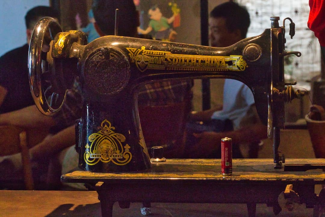 a sewing machine sitting on top of a wooden table